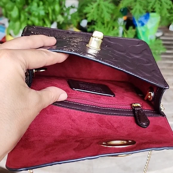 Coach Embossed Brown Crossbody Bag with Gold Chain